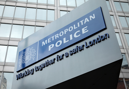 London, England - May 8, 2011: The famous New Scotland Yard sign, outside the Metropolitan police headquarters in London.