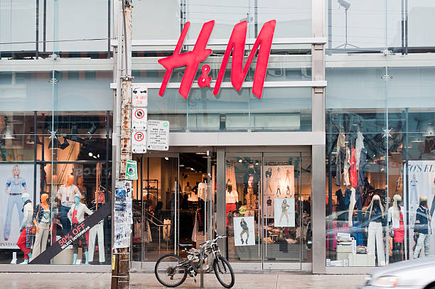 H&M Toronto, Canada - March 10, 2011: The exterior of the H&M retail store on Queen Street West in Toronto.   H&M is a Swedish clothing company with over 2,200 stores worldwide. h and m stock pictures, royalty-free photos & images