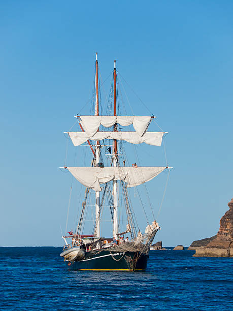 Tall Ship at Whitsunday Sialnds Mackay, Queensland - August 17, 2008: The "Soloway Lass", a Tall Ship working as a tour boat at the Whitsunday Islands in Queensland, Australia. People can be seen on board the ship, including on the sails. solloway lass stock pictures, royalty-free photos & images