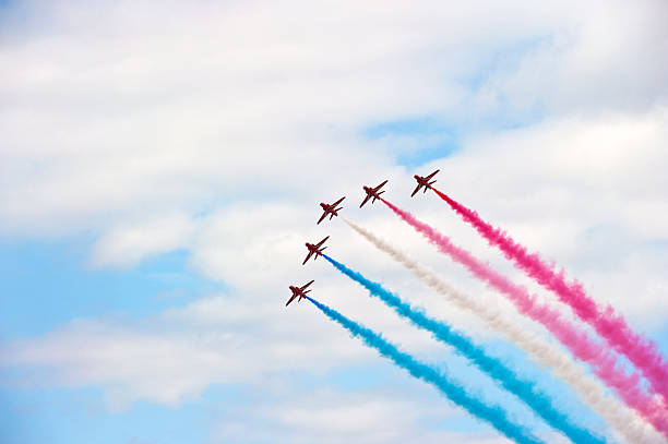 Red Arrows, Farnborough AIr Show Farnborough, England - 24th July 2010. The Royal Air Force aerobatic display team The Red Arrows perform at the Farnborough International Air-Show. british aerospace stock pictures, royalty-free photos & images