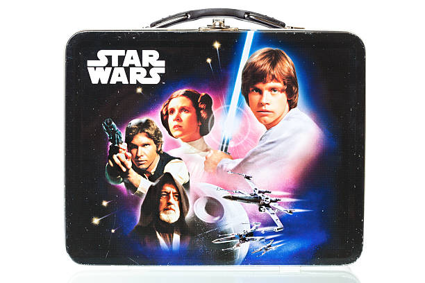 Star Wars Lunch Box With Reflection, Isolated on White USA - Feb 3, 2011: 1980s Star Wars Lunch Box Isolated on White. This is from the original Star Wars released in the 1977 with the sequels following in the early 80s. Manufactured by Tin Box Company in Farmindale, NY. star wars stock pictures, royalty-free photos & images