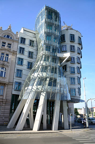 Dancing House, Prague "Prague, Czech Republic - May 24, 2011: Dancing House. Others have nicknamed it ""Drunk House"". The building was designed by Vlado Milunic and Frank Gehry in 1992 and completed in 1996. Originally named Fred and Ginger the house stands out among the Baroque, Gothic and Art Nouveau buildings for which Prague is famous." dancing house prague stock pictures, royalty-free photos & images