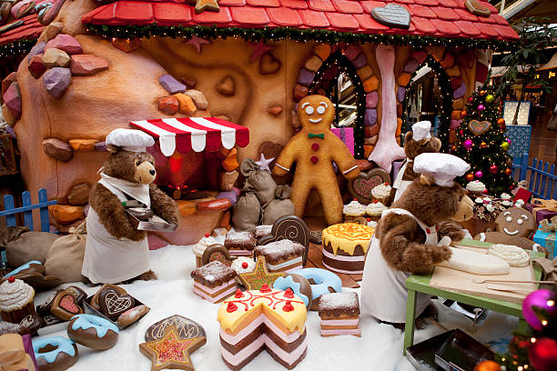 Lodz, Poland - December 11, 2011: Gingerbread cottage, Christmas decorations and share in the mall in  Manufaktura in Lodz.