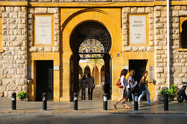 American University Beirut entrance Beirut, Lebanon - September 23, 2010: Students walk out an entrance to the American University of Beirut (AUB), which was founded in 1866 and is a private, non-sectarian institution of higher learning. The educational philosophy, standards, and practices of AUB are based on the American liberal arts model of higher education; it has around 700 instructional faculty and a student body of around 8,000 students. lebanon beirut stock pictures, royalty-free photos & images