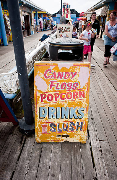 Candy apples and pizza are some of the fast food options on display at a county fair.