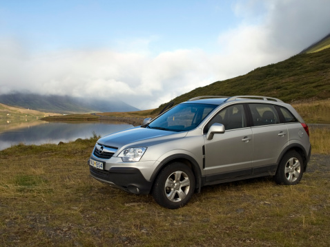Akyreyri, Iceland - September 4, 2008: A silver Opel passenger car is parked in a field overlooking the lake in Akureyri, Iceland
