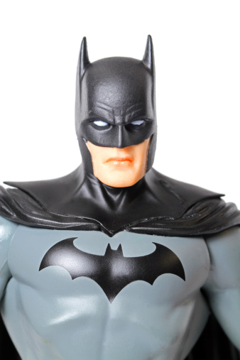Vancouver, Canada - April 9, 2012: An action figure model of Batman, sculpted by Paul Harding and released by DC comics, against a white background.
