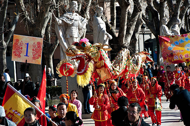 Madrid, Spain - January 21, 2012:A ceremonial dragon is danced through the streets of Madrid, Spain as part of Chinese New Year celebrations