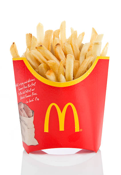 McDonald's Fries Newcastle upon Tyne, England - March 5, 2011: McDonald's french fries isolated on a white background. McDonald's is one of the largest fast food chains in the world. MCDONALDS FRIES stock pictures, royalty-free photos & images