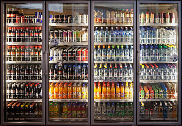 Glass cabinets with diverse range of softdrinks. stock photo