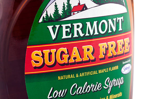 Vermont Sugar Free Syrup Cinnaminson, New Jersey, USA- April 14, 2011: Product shot of Vermont - Sugar Free Low Calorie syrup with natural and artifical maple flavor, sweetened with splenda, an artifical sweetner maple-syrup-label stock pictures, royalty-free photos & images