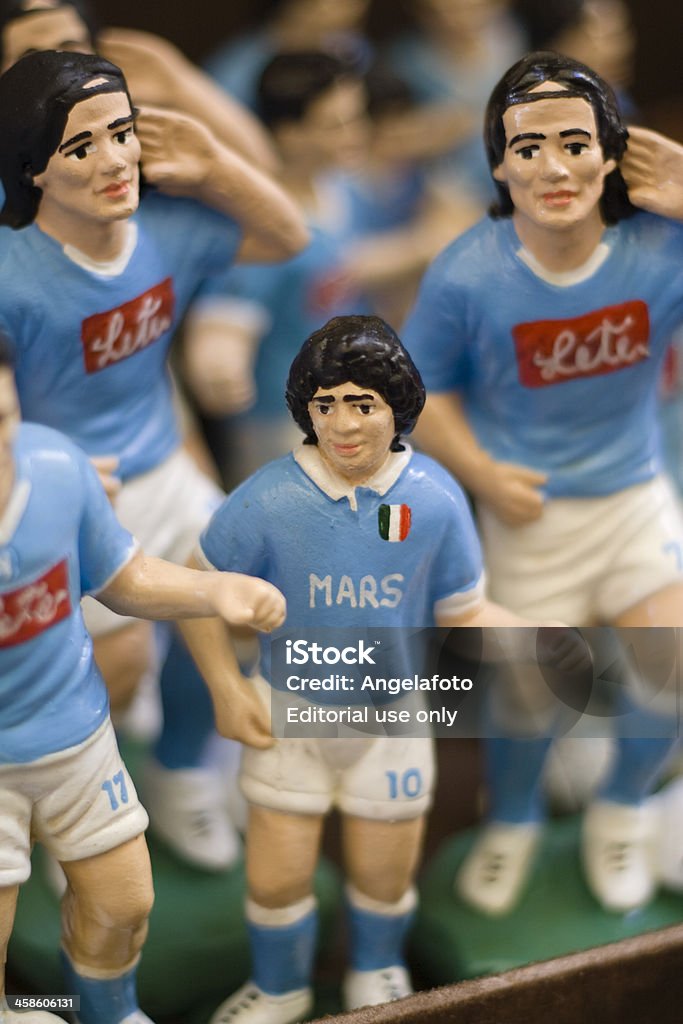 Soccer Players Figurines in Naples Market Street Naples, Italy  - October 9, 2011: Collection of hand manufactured puppets from a craftsmen shop in San Gregorio Armeno street. Figurines representing famous Naples soccer players. Diego Maradona Stock Photo