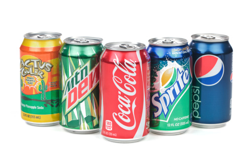 Pomona, CA USA  - July 27, 2011: A bunch of soda cans on an isolated white background. The drinks in this picture are Coca-Cola, Cactus Cooler, Mountain Dew, Sprite, Pepsi.