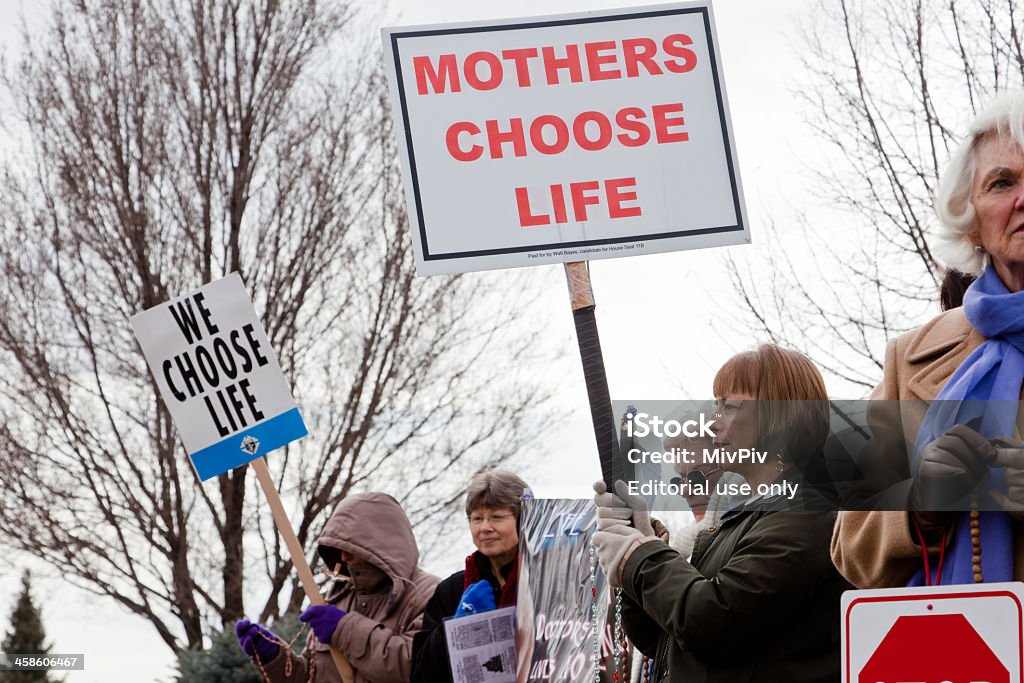 Women protesting against abortion Boise, Idaho, USA - March, 9 2011: Women protesting against abortion outside a family planning center Abortion Stock Photo