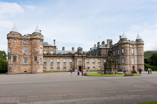 Edinburgh, Scotland - August 4, 2010: The front entrance to The Palace of Holyroodhouse at the bottom of the Royal Mile in Edinburgh, Scotland.  This is the official residence of the monarch in Scotland.