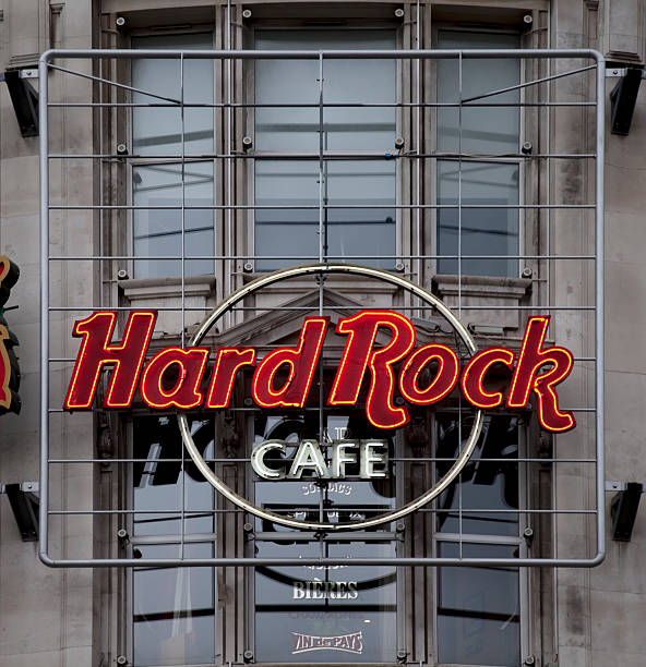 Manchester, UK - August 20, 2011: Hard Rock Cafe neon sign and logo. Hard Rock Cafe is a chain of theme restaurants founded in 1971 and now owned by the Seminole tribe of Florida.