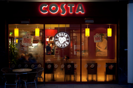York, UK - December 14, 2011: Costa Coffee shop window, sign and logo. Some customers can be seen inside. Costa Coffee is a multi-national coffeehouse company headquartered in Dunstable, United Kingdom and a wholly owned subsidiary of Whitbread. It is the largest coffeehouse chain in the United Kingdom and second-largest in the world.