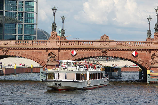 Tourist boat on the Spree River in Berlin Berlin, Germany - May 4, 2008: Tourist boat on the Spree River in Berlin moabit stock pictures, royalty-free photos & images