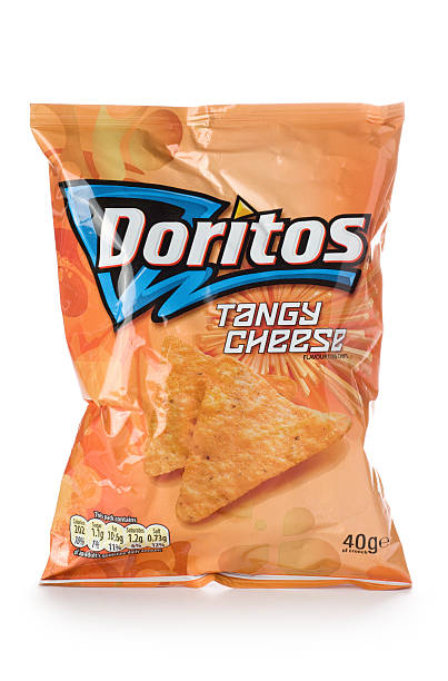 Doritos tangy cheese tortilla chips on a white background "St Ives, England - October 20, 2011: A packet of Doritos Tangy Cheese flavoured tortilla chips isolated on white background. Doritos are produced by the American food company Frito-Lay, a division of PepsiCo, Inc." tangy stock pictures, royalty-free photos & images