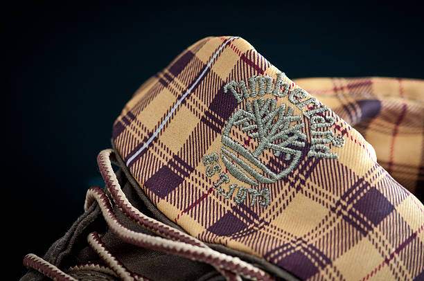 Timberland boots detail Udine, Italy - November 1, 2011: Timberland logo impressed on men leather boots timberland arizona stock pictures, royalty-free photos & images