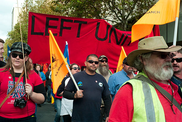 May Day March Adelaide, Australia - May 5th, 2012: People marching down King William Street during the annual May Day march. left wing politics stock pictures, royalty-free photos & images