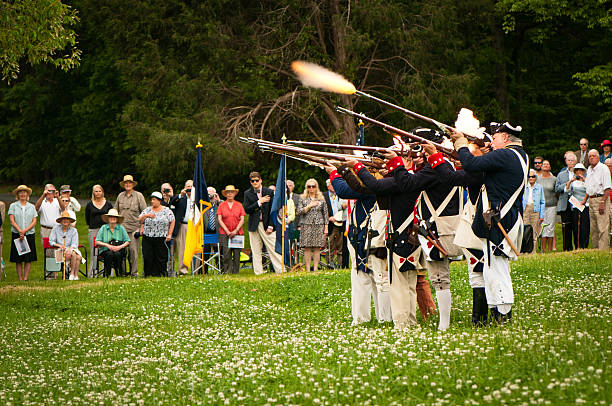American Independance Militia Charlottesville, USA - May 5, 2012: The Color Guard Salute Firing during the ceremony of unveiling the mile marker commemorating the site known as The Barracks. firing squad stock pictures, royalty-free photos & images