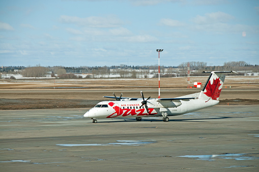 Edmonton Alberta- April 12, 2011 :An  Air Canada Jazz tuboprop waiting for clearance for take-off.  Air Canada is the main carrier in Canada and Jazz is the regional carrier for Air Canada with main offices in Halifax, Nova Scotia.