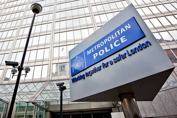 New Scotland Yard, Metropolitan Police HQ in London London, United Kingdom - September 3, 2011: The headquarter of the London Metropolitan police, New Scotland Yard and its revolving sign outside, which performs over 14,000 revolutions every day. metropolitan police stock pictures, royalty-free photos & images