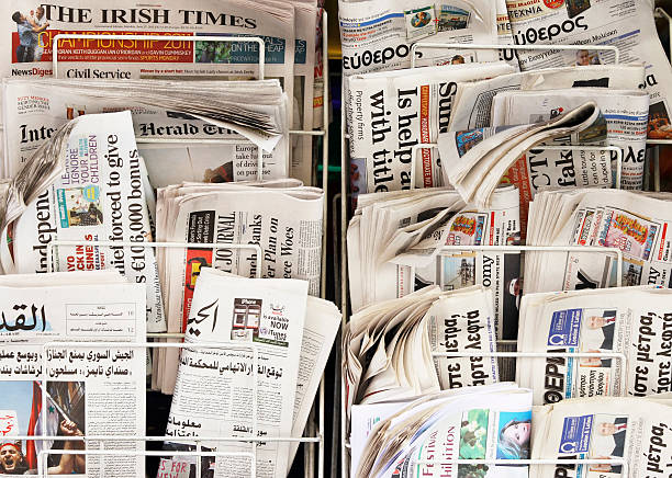 Newspapers from the world London, England - June 27, 2011: A display with international newspapers on the street, Soho, London. news stand stock pictures, royalty-free photos & images