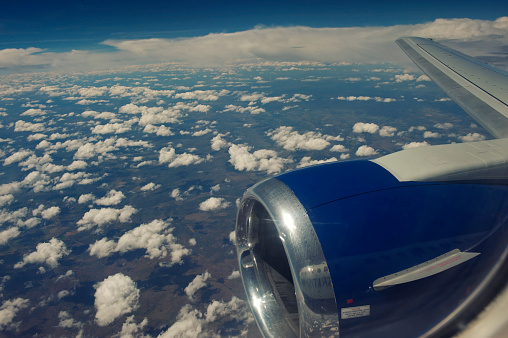 In flight ,South Africa - March 28, 2012: Engine and wing of a Boeing 737-300 British Airways operated by Comair , a South African aviation company, during a flight from Johannesburg to Victoria Falls in Zimbabwe.