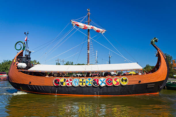 Aeba, Poland - August 03, 2011: Viking tourist boat  transports tourists across the Aeba harbour to the Baltic Sea for a cruise