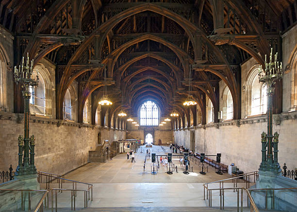 London, UK - 24 July 2010: Tourists queuing in Westminster Hall for a tour of the Houses of Parliament, which are offered when Parliament is in recession. Westminster Hall is the only surviving medieval part of the Houses of Parliament and has a famous wooden ceiling.