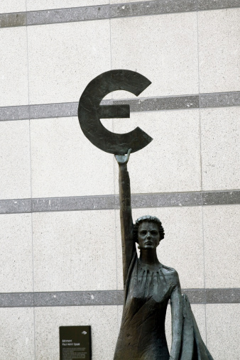 Brussels, Belgium - April, 23th 2011: Euro statue in front of European Parliament so-called building Espace LAopold in Brussels. Dtatue is at left side of entrance of building.