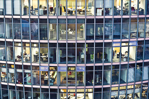 Workers on The Offices of Deutsche Bahn, Berlin Berlin, Germany - November 16, 2011: Several people working on the offices of the skyscraper that is the headquarter of the Deutsche Bahn, the German national railway company. deutsche bahn stock pictures, royalty-free photos & images
