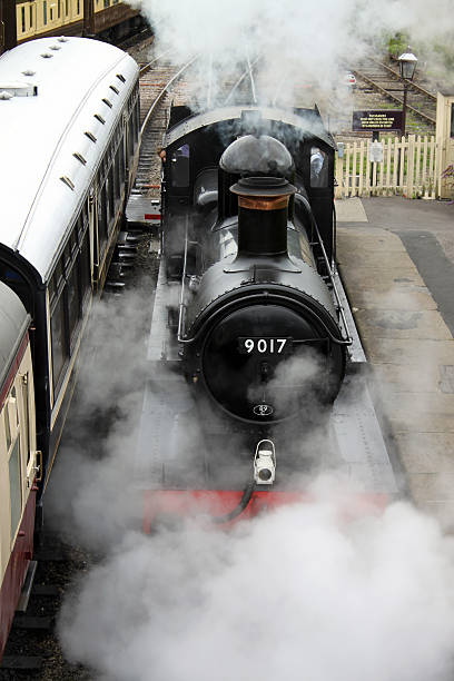 August 9th.2019 The Gloucestershire and Warwickshire heritage steam railway. Toddington Steam centre and Station. A sunny summer day at a popular tourist destination. This is a steam hauled train with tourists and passengers on board.