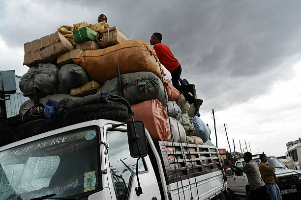 Addis Ababa, Ethiopia - April, 6th 2009: African Men Loading Truck with Big Bags in the Centre of Addis Ababa at Merkato Market