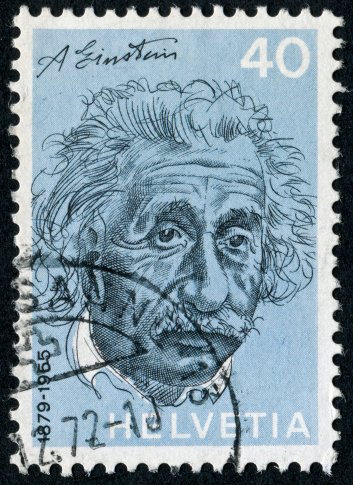Sacramento, California, USA - March 19, 2011: 1956 Israel postage stamp with a portrait of Albert Einstein to the right of his E=mc2 equation.