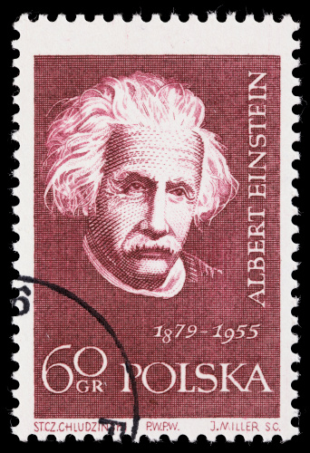 Sacramento, California, USA - March 19, 2011: A 1959 Poland postage stamp with an image of Albert Einstein (1879-1955), issued as part of the Scientists series. The stamp was designed by S.C. Chuldzinski, the plate designer was J. Miller, and the printer was PWPW.