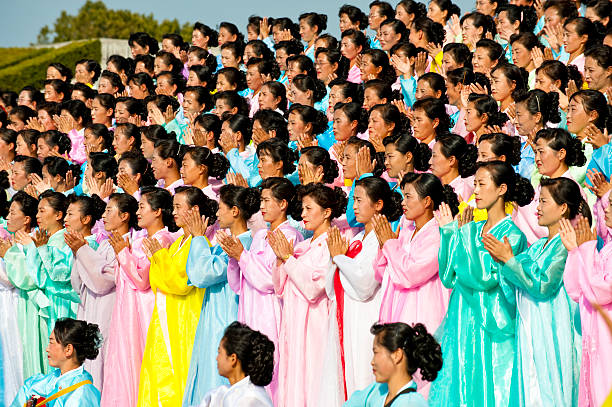 Pyongyang, North Korea - Oct 06, 2009: A group of female performer are rehearsaling in front of Juche Tower, the landmark of Pyongyang.