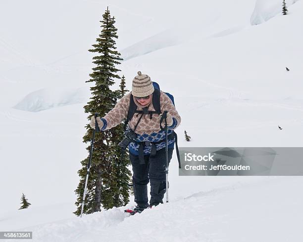 Senior Woman Snowshoing At Mount Rainier Stock Photo - Download Image Now - Senior Adult, Snowshoe, Snowshoeing