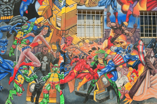 Albuquerque, New Mexico, USA - July 1, 2011: Composite mural of Marvel comic book superheroes and villains, vividly illustrated and painted on a large building facade on Central Avenue (Route 66) in Albuquerque New Mexico.