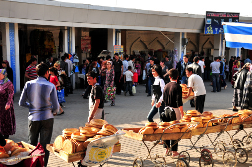 Tashkent, Uzbekistan - 17th April, 2011: Shoppers and traders engaging each other in Chorsu bazaar in the old city of Tashkent, Uzbekistan.