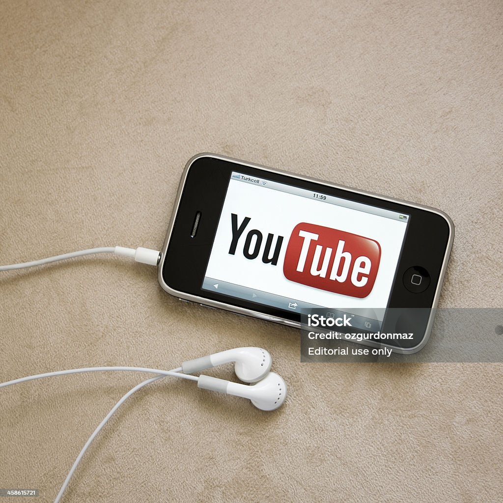 Youtube logo on iPhone screen Antalya, Turkey - June 8, 2011: Youtube logo on iPhone screen with head phones. YouTube is the largest video sharing website in the world. Headphones Stock Photo