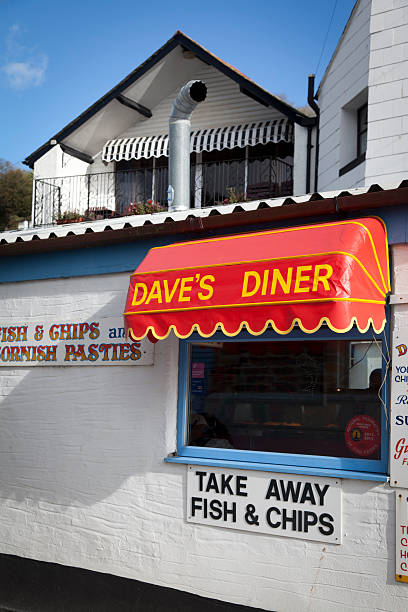 Fish and chips sign at typical UK seaside resort