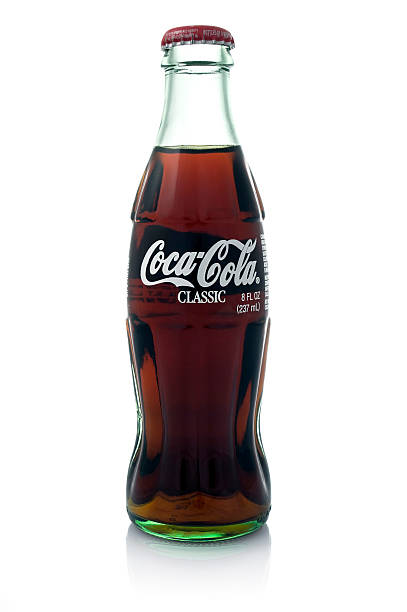 Coke Los Angeles, USA - May 1, 2011: A Coca-Cola glass bottle on a white isolated background. coke coal stock pictures, royalty-free photos & images