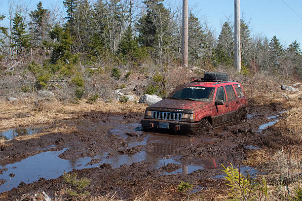 Jeep Stuck in the Mud "Annapolis Valley, Nova Scotia, Canada - April 17, 2008: A Jeep Grand Cherokee is stuck in the mud." creighton stock pictures, royalty-free photos & images