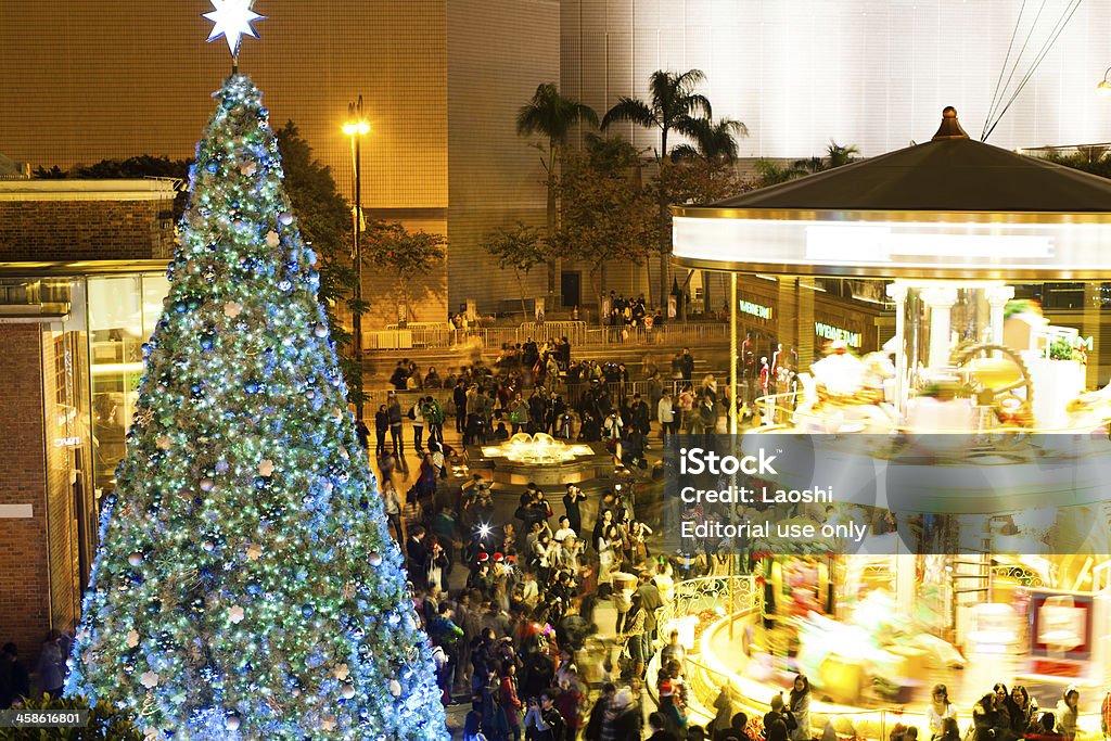 Christmas Decoration in Hong Kong Hong Kong, China - December 24, 2010: Street Night View of Tsim Sha Tsui with Christmas Decoration. As a tradition, tens of thousands of locals and tourists venture out onto the streets on Christmas Eve to celebrate Christmas, see street performances, and admire Christmas lights and decorations on the streets. Christmas Stock Photo