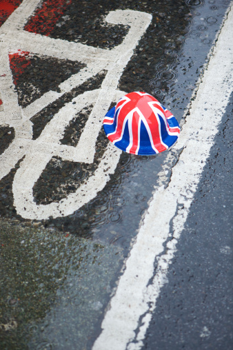 London, United Kingdom - June, 3rd 2012: An abandoned Union Jack hat, left on Tooley street in the pouring rain, as thousands of visitors make their way home after the Queen's diamond Jubilee River Pageant.