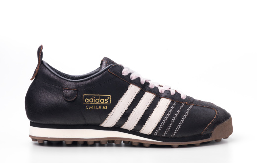 London, United Kingdom - October 31st 2011: single adidas chile 62 trainer, shot in studio, Adidas AG is a German sports apparel manufacturer.