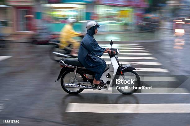 Motorcycling Through A Storm In Vietnam Stock Photo - Download Image Now - Asia, Asian and Indian Ethnicities, Blurred Motion